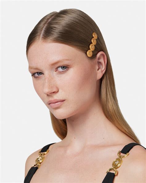fermagli versace fake